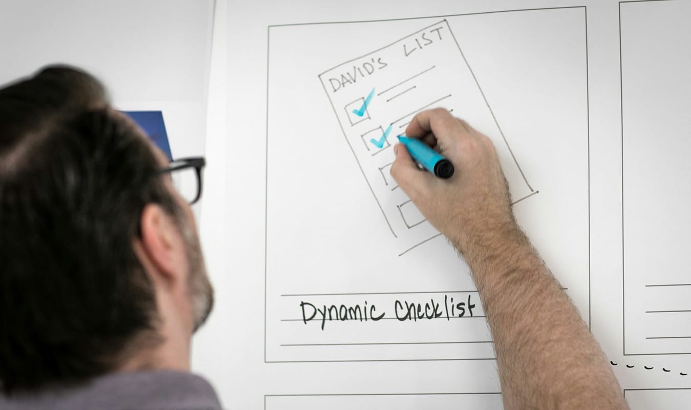 Hand-drawn checklist on a whiteboard, standing in for the warning signs worth checking before you build
